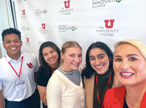 a picture of Bridget Burns with four University of Utah UIA fellows. 