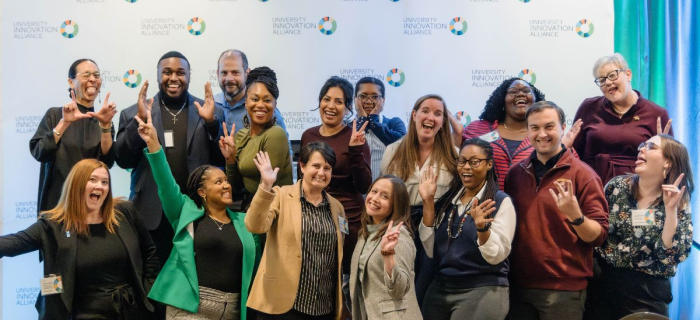 Team UIA with the UIA logo on white paper in the background