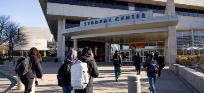 Students walking toward a student center.