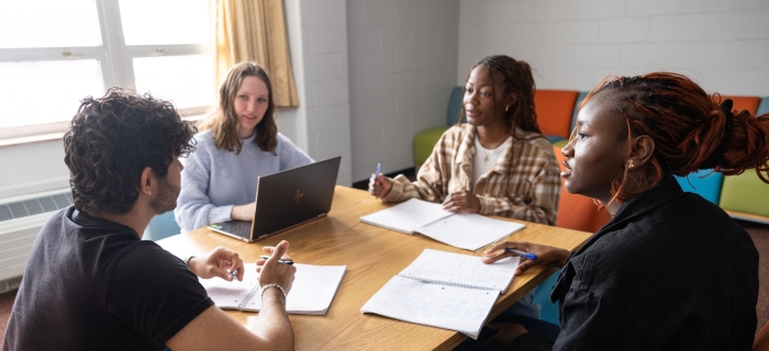 A group of diverse students sitting around a table